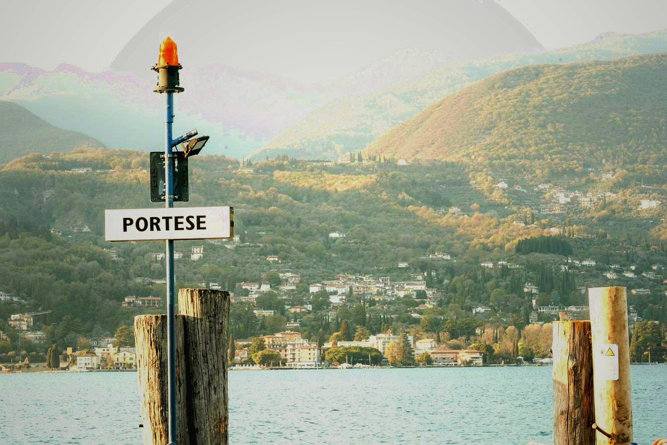 Portese harbour with Lake Garda and mountain backdrop — San Felice del Benaco western shore